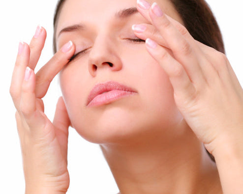 massaging eyes