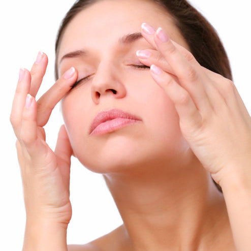 massaging eyes
