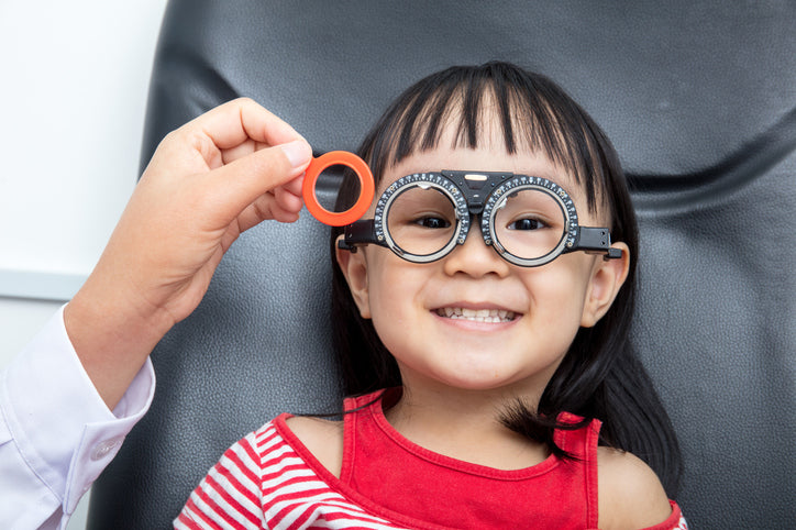 child having eye exam