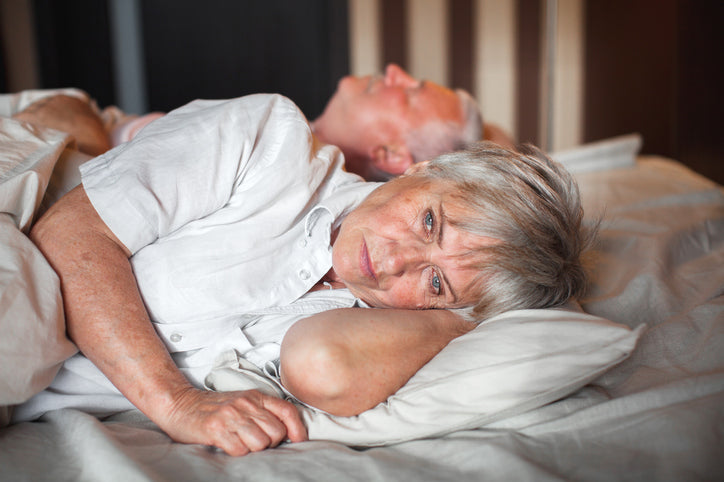 older woman awake in bed