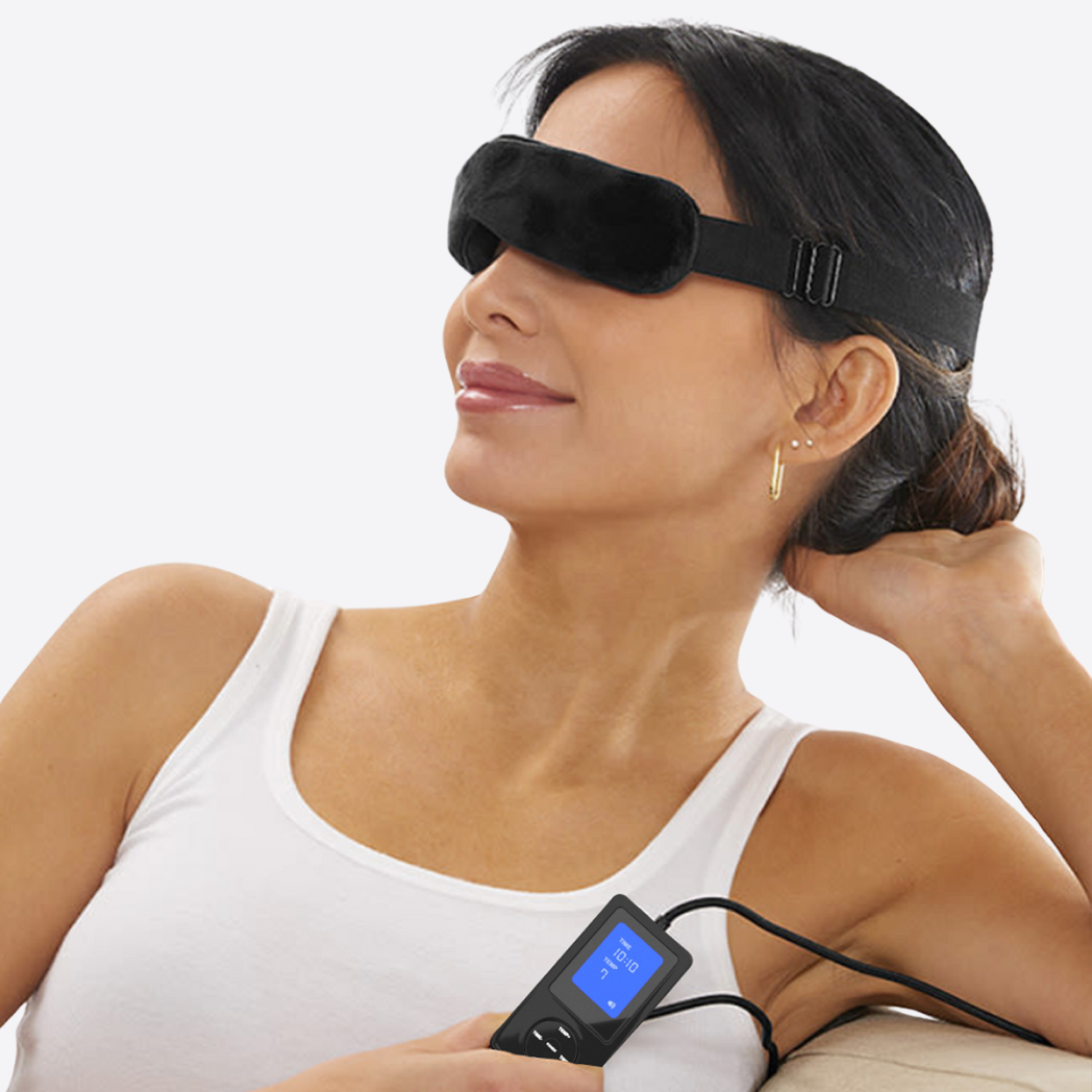 Woman wearing Wizard Research heated eye mask with digital controller for soothing dry eye relief therapy
